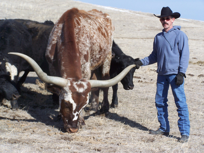 Martin Jurisch with a longhorn steer he raised near Hereford, South Dakota